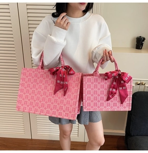 Detail of pink bridal tote bags in two sizes with Chinese Xi pattern and red silk scarf
