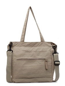 Minimalist khaki nylon tote bag with wide shoulder strap and waterproof fabric