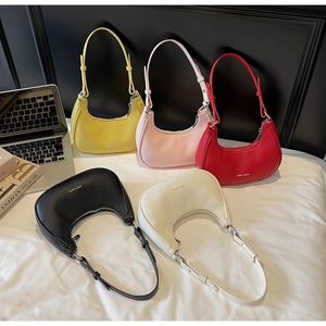 Selection of crescent moon shoulder bags in five colors with litchi grain texture detail