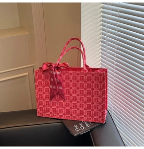 Detail of red wedding tote bag with traditional Double Happiness jacquard and silk scarf