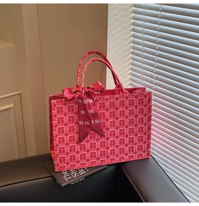 Detail of red bridal tote bag with traditional Chinese Double Happiness jacquard and scarf
