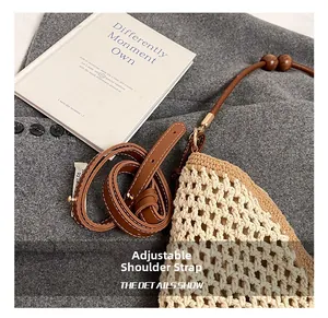 Detail of adjustable leather strap with dark wooden beads on beige crochet tote bag