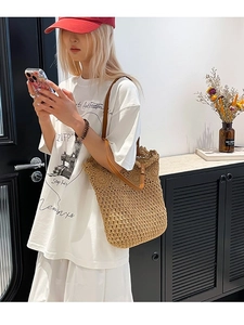 Handcrafted crochet tote bag with circular patterns and brown leather straps for summer
