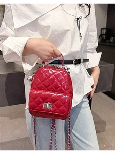 Fashionable red quilted mini backpack with silver twist lock and metal chain strap