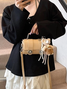 Chic khaki patent leather pillow bag with silver turn-locks and cute bear pendant