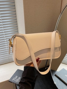 Elegant white litchi pattern underarm bag with gold hardware and adjustable strap