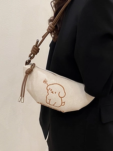 Sac bandoulière demi-lune en toile crème avec broderie chiot et bandoulière à nœuds