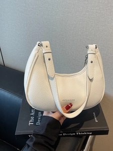 White lychee leather half-moon hobo bag with silver metal zipper and brand lettering