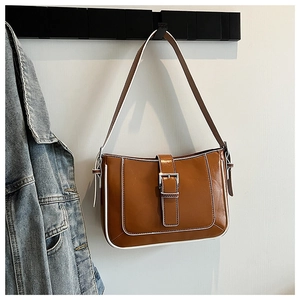 Close-up of brown PU leather hobo bag with contrast stitching and metal buckle detail