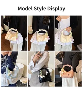 Detail showing ruched dumpling bag with metal chain strap and tulip charms on a model