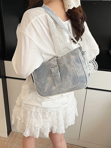 Vintage light blue crescent underarm bag with silver buckle and white trim detail