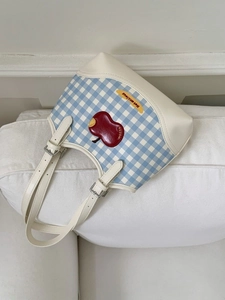 Blue plaid canvas tote bag with red apple patch and adjustable white leather strap