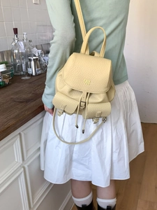 Yellow pebble leather mini backpack for women featuring Pantor logo and drawstring closure
