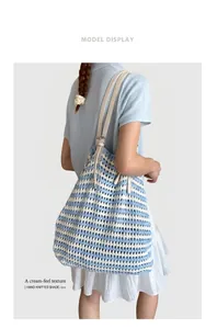 Blue and white striped crochet tote bag with cream leather straps on a model's shoulder