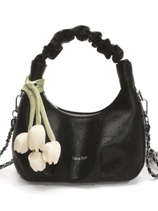 Black dumpling bag with floral embossing, ruched handle and tulip charm detail