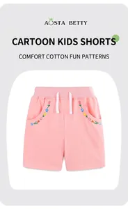 Détail d'un short rose en coton pour fille avec taille élastique, cordon et broderie florale