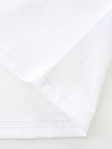 T-shirt bianca in cotone per bambina con orlo a doppia cucitura e trama in maglia