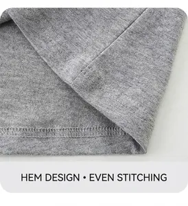 Gros plan sur l'ourlet à double aiguille du t-shirt en coton gris pour garçon