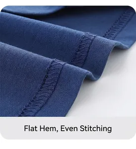 Close-up of the neat double-stitch hem on a blue cotton boy's short sleeve T-shirt