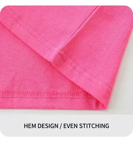 Detail of pink cotton knit T-shirt showing neat double-needle stitching on the hemline