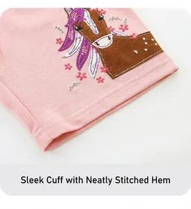 Detail of pink cotton shorts for girls featuring cute horse embroidery and floral accents