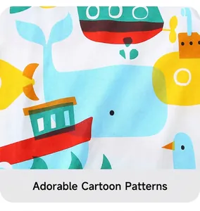 Close-up of soft cotton fabric featuring bright blue whales and yellow submarine prints