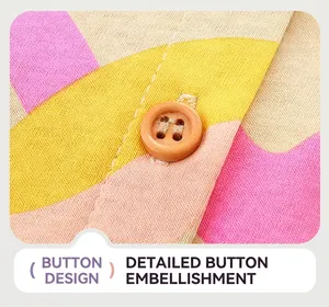 Close-up of a wooden button on colorful geometric knit fabric for a girl dress