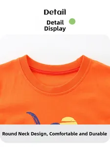 Detail of a boy's orange crew neck t-shirt with reinforced seams and cotton texture