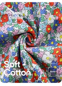 Close-up of 100% soft cotton fabric with colorful floral patterns for girls' summer dresses