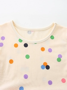 Abito estivo in tulle da bambina con pois multicolore e girocollo in maglia morbida