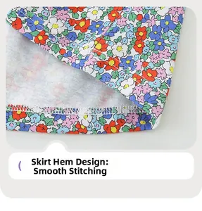 Detail of neatly stitched hem on floral girls' dress with vibrant knit fabric patterns