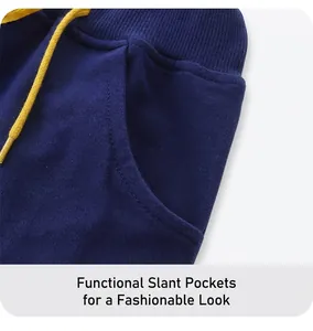 Detail of navy knit shorts featuring ribbed waistband and yellow drawstring closure
