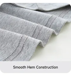 Detail of grey knitted cotton t-shirt hem showing neat double-needle stitching and fabric