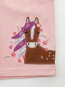 Girls' pink knit shorts featuring detailed horse embroidery and floral applique design