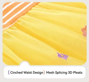 Détail de robe en tulle jaune pour fille avec broderie 3D et taille en mesh plissée