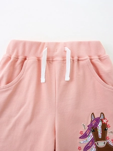 Pink cotton knit shorts for girls featuring a rainbow horse embroidery and white drawstring