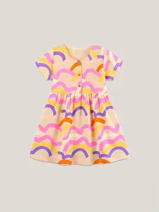 Girls short sleeve knit cotton dress featuring vibrant rainbow wave patterns and wood buttons