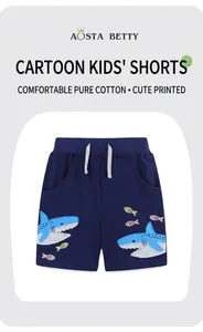 Detail of shark embroidery and grey drawstring on navy knit cotton boys' shorts