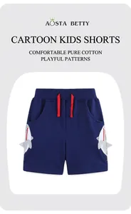 Détail du short enfant marine en coton avec broderie requin et cordon de serrage rouge