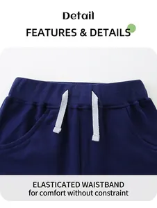Detail of navy knit shorts featuring an elastic waistband with a white decorative drawstring