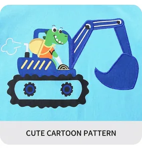 Close-up of embroidered green dinosaur driving an excavator on blue cotton fabric