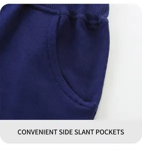 Detail of navy blue knit shorts showing slanted side pocket and ribbed waistband