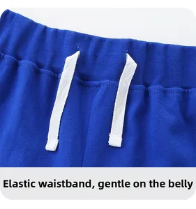 Detail of royal blue elastic waistband with white drawstring on cotton kids shorts