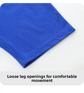 Detail of royal blue cotton shorts featuring neat double-stitched hem and loose fit