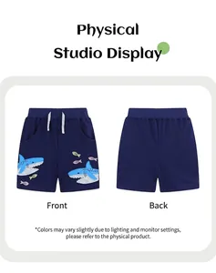 Front and back view of dark blue boys sports shorts with shark embroidery detail