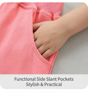 Detail of pink cotton knit shorts for girls showing ribbed waistband and side pockets