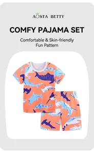 Détail du pyjama en coton orange pour garçons avec motif requin bleu imprimé