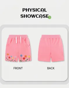 Detail of pink cotton girl shorts with floral embroidery and adjustable drawstring