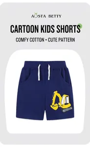 Detail of navy blue kids cotton shorts featuring yellow excavator print and drawstring