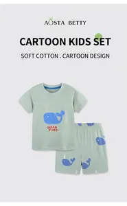 Detail of mint green cotton boys outfit with cute ocean vibes whale embroidery